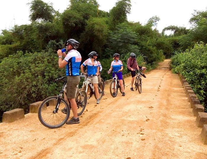 Cycling on Ho Chi Minh Trails, explore DMZ, ride on Hien Lien Bridge, visit Vinh Moc tunnels, ride to A Luoi