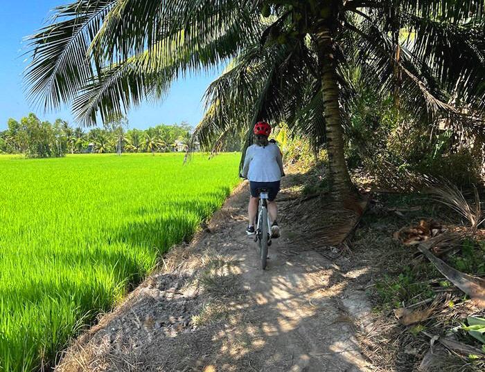 Biking Mekong Delta, venture onto bike trails, in Tra Vinh, see flaoting market, boat to Phnom Penh